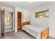 Simple bedroom with an open doorway, closet, and window at 2020 Wilandrew Dr, Decatur, GA 30033