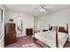 Bright bedroom features hardwood furniture and a large bed at 2020 Wilandrew Dr, Decatur, GA 30033