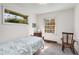 Cozy bedroom with a large window, chair, and dresser at 2020 Wilandrew Dr, Decatur, GA 30033