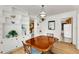 Warm dining room featuring hardwood floors, charming chandelier, and built-in cabinets at 2020 Wilandrew Dr, Decatur, GA 30033