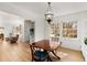 Open dining room with hardwood floors, built-in shelving, and abundant natural light at 2020 Wilandrew Dr, Decatur, GA 30033