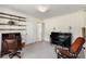 Cozy living room with classic furniture, shelves, and access to other rooms at 2020 Wilandrew Dr, Decatur, GA 30033