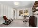 Office space with wood shelves, vintage furniture, and natural light at 2020 Wilandrew Dr, Decatur, GA 30033