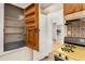 Vintage pantry with shelves near kitchen with original details at 2020 Wilandrew Dr, Decatur, GA 30033
