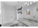 Bathroom features a shower-tub combo, granite vanity, and custom industrial shelves at 2571 Hamill Dr, Buford, GA 30519