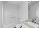 Clean bathroom features a shower-tub combo with a white tile surround and a granite countertop sink at 2571 Hamill Dr, Buford, GA 30519