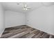 Bedroom features neutral color scheme, ceiling fan and wood look flooring at 2571 Hamill Dr, Buford, GA 30519