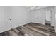 Bedroom with gray floors, white walls, ceiling fan and closet at 2571 Hamill Dr, Buford, GA 30519