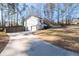 View showcases a single-Gathering home with a fenced yard, long driveway, and a large front lawn at 2571 Hamill Dr, Buford, GA 30519