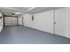 Spacious garage with epoxy flooring and white walls, offering ample parking at 2571 Hamill Dr, Buford, GA 30519