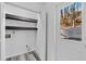 Practical mud room with convenient storage shelves and an exterior door, enhancing functionality at 2571 Hamill Dr, Buford, GA 30519
