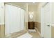 Bathroom with a shower, vanity, decorative mirror, and neutral color scheme at 1605 Ridge Haven Run, Alpharetta, GA 30022