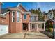 Close up of the brick exterior with a view of the front porch, entry and attached garage at 1605 Ridge Haven Run, Alpharetta, GA 30022