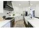 Gourmet kitchen featuring quartz countertops, stainless steel appliances, and a herringbone backsplash at 1605 Ridge Haven Run, Alpharetta, GA 30022