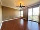 Bedroom featuring hardwood floors, a ceiling fan, and balcony access at 2626 Peachtree Nw Rd # 1007, Atlanta, GA 30305