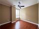 Bedroom with hardwood floors, shutters on the window, fan and neutral walls at 2626 Peachtree Nw Rd # 1007, Atlanta, GA 30305