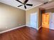 Bedroom featuring hardwood floors, ceiling fan, ensuite bathroom and warm, neutral paint colors at 2626 Peachtree Nw Rd # 1007, Atlanta, GA 30305