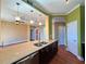 Open kitchen with a center island featuring granite countertops, stainless steel appliances, and modern lighting at 2626 Peachtree Nw Rd # 1007, Atlanta, GA 30305