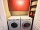 Convenient laundry area with side-by-side washer and dryer, complemented by built-in cabinets for storage at 2626 Peachtree Nw Rd # 1007, Atlanta, GA 30305