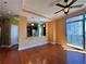 A comfortable living area featuring hardwood floors, fan and adjacent to a modern kitchen at 2626 Peachtree Nw Rd # 1007, Atlanta, GA 30305
