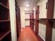 Large walk-in closet with custom shelving and ample storage at 2626 Peachtree Nw Rd # 1007, Atlanta, GA 30305