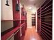 Spacious walk-in closet features custom shelving, drawers, and hardwood floors for easy organization and ample storage at 2626 Peachtree Nw Rd # 1007, Atlanta, GA 30305