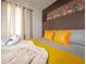 Cozy bedroom featuring decorative wall art, stylish pillows and a comfortable bed at 3490 Primrose Pl, Decatur, GA 30032