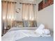 Comfortable bedroom featuring plush bedding, decorative pillows, and stylish curtains at 3490 Primrose Pl, Decatur, GA 30032