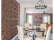 Dining area featuring table, chairs, and chandelier with geometric wall art and floral wall paper at 3490 Primrose Pl, Decatur, GA 30032