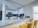 Well-lit kitchen featuring granite countertops, stainless steel appliances, and stylish bar stool seating at 3490 Primrose Pl, Decatur, GA 30032