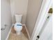 Compact bathroom featuring a toilet, towel rack and tiled floor at 493 Townsend Bnd, Stockbridge, GA 30281