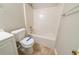 Well-lit bathroom features a shower-tub combo and matching commode and vanity at 493 Townsend Bnd, Stockbridge, GA 30281