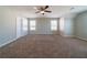 Spacious bedroom with neutral walls and carpet, featuring two windows at 493 Townsend Bnd, Stockbridge, GA 30281