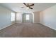Large bedroom with neutral carpet and ample natural light at 493 Townsend Bnd, Stockbridge, GA 30281