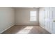 Bedroom featuring neutral walls, carpet flooring, and a window at 493 Townsend Bnd, Stockbridge, GA 30281