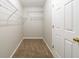 Walk-in closet with carpet flooring and wire shelving at 493 Townsend Bnd, Stockbridge, GA 30281