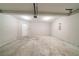 An empty garage with a concrete floor and white walls at 493 Townsend Bnd, Stockbridge, GA 30281