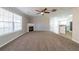 Spacious living room with a fireplace and large windows for natural light at 493 Townsend Bnd, Stockbridge, GA 30281