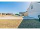 A suburban street with homes and lawns with a driveway and garage at 493 Townsend Bnd, Stockbridge, GA 30281