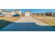 A long driveway leads to the street in a neighborhood of suburban homes at 493 Townsend Bnd, Stockbridge, GA 30281