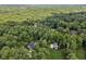 Aerial view of property nestled amongst trees, showcasing its sprawling size and private setting at 5323 Presley Pl, Douglasville, GA 30135