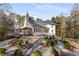Manicured backyard showcasing professional landscaping and mature trees at 5323 Presley Pl, Douglasville, GA 30135