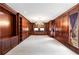 Expansive closet with custom wood shelves, cabinets, and carpeted floor at 5323 Presley Pl, Douglasville, GA 30135