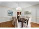Bright dining room with chandelier and hardwood floors at 5323 Presley Pl, Douglasville, GA 30135