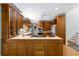 Spacious kitchen featuring wooden cabinets, tile countertops, and modern appliances at 5323 Presley Pl, Douglasville, GA 30135