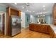 Spacious kitchen with stainless steel appliances, hardwood floors, and an eat-in breakfast nook at 5323 Presley Pl, Douglasville, GA 30135