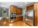 Kitchen featuring stainless steel appliances, wood cabinetry, and a convenient wine rack at 5323 Presley Pl, Douglasville, GA 30135