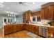 Spacious kitchen featuring wood cabinets, stainless steel appliances, and hardwood floors at 5323 Presley Pl, Douglasville, GA 30135