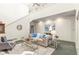 Bright living room with tall ceilings with a sitting area, sofas, and a glass coffee table at 5323 Presley Pl, Douglasville, GA 30135