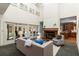 Bright living room with a fireplace, tall ceilings and multiple access points to the outside at 5323 Presley Pl, Douglasville, GA 30135